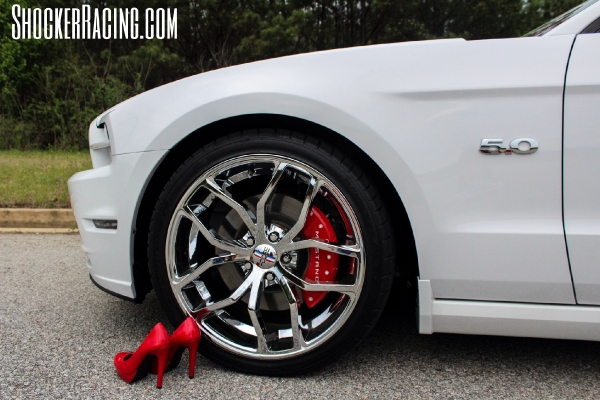 Taylor Ethridge with her 2014 Mustang 5.0