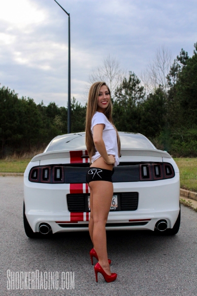 Taylor Ethridge with her 2014 Mustang 5.0