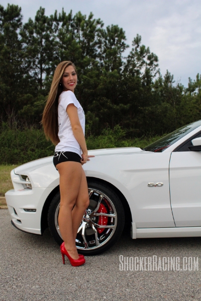 Taylor Ethridge with her 2014 Mustang 5.0